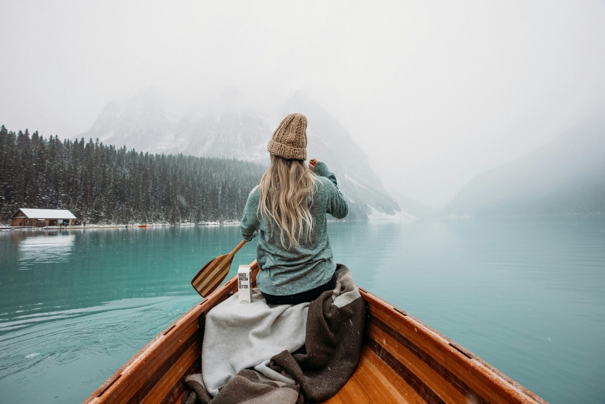 A woman paddling a canoe—another way to thrive outdoors. This symbolizes the path you might take if you learn from our resources.