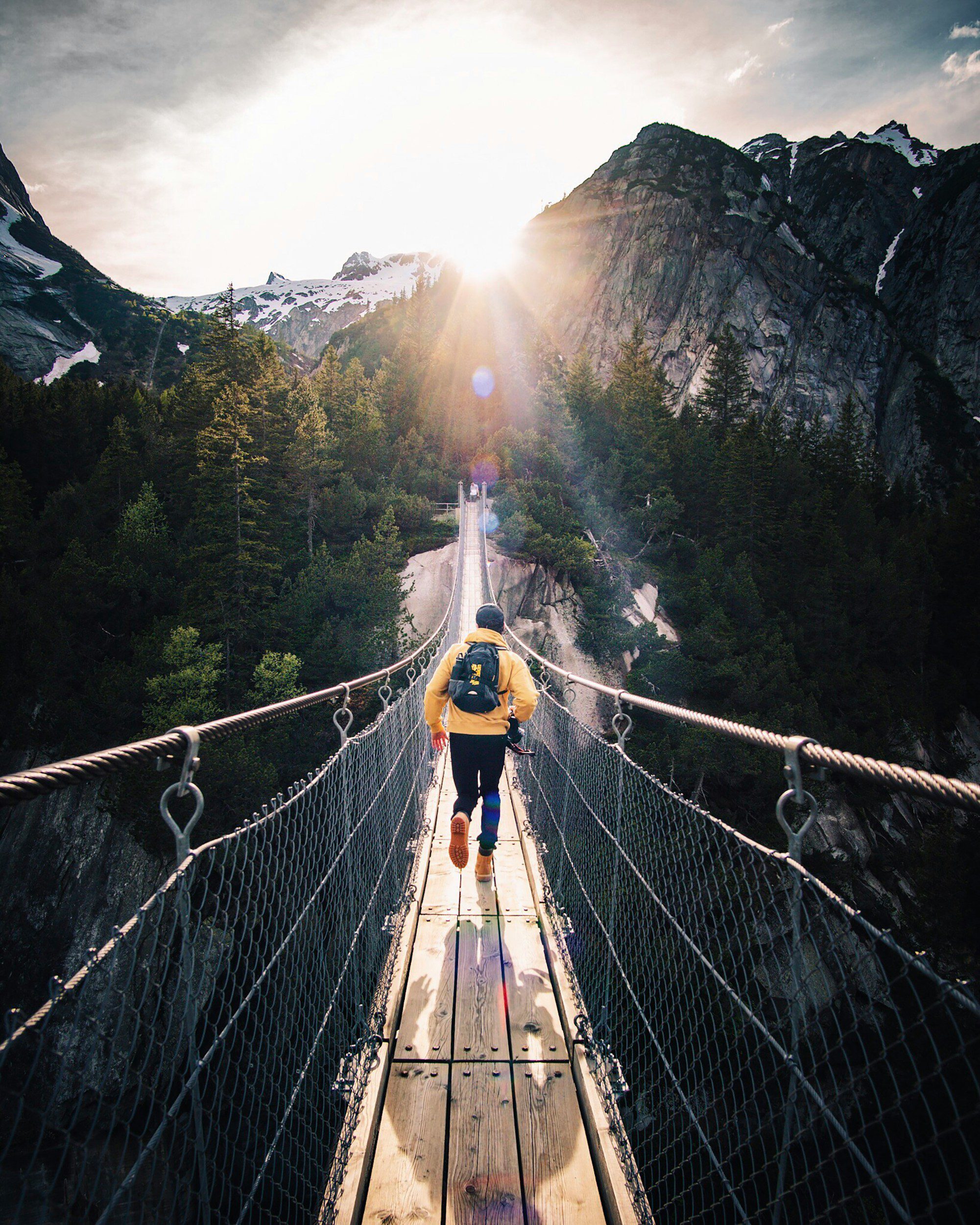 A narrow rope bridge symbolizes the path people might want to take when using the Thriving Outdoors Collective server.